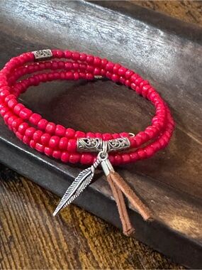 Artisan Red Beaded Wrap Bracelet with Feather and Tassel Charms